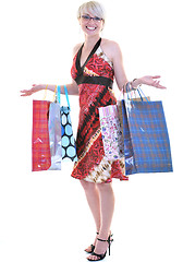 Image showing happy young adult women  shopping with colored bags