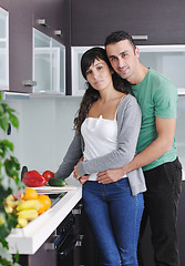 Image showing young couple have fun in modern kitchen