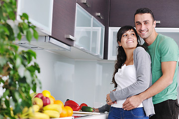 Image showing young couple have fun in modern kitchen