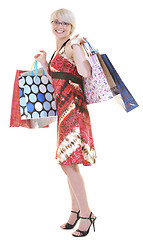 Image showing happy young adult women  shopping with colored bags