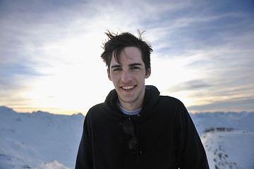 Image showing happy young man have fun at winter on mountain peak