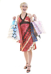 Image showing happy young adult women  shopping with colored bags