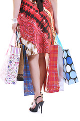 Image showing happy young adult women  shopping with colored bags