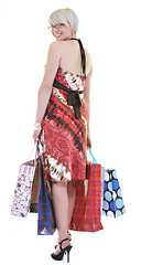 Image showing happy young adult women  shopping with colored bags