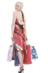 Image showing happy young adult women  shopping with colored bags