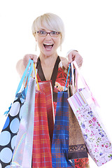 Image showing happy young adult women  shopping with colored bags