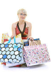 Image showing happy young adult women  shopping with colored bags