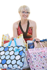 Image showing happy young adult women  shopping with colored bags