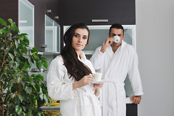 Image showing Young love couple taking fresh morning cup of coffee