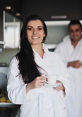 Image showing Young love couple taking fresh morning cup of coffee