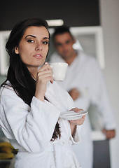 Image showing Young love couple taking fresh morning cup of coffee