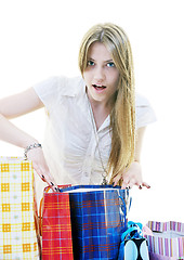 Image showing happy young adult women  shopping with colored bags