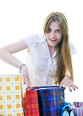 Image showing happy young adult women  shopping with colored bags
