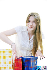 Image showing happy young adult women  shopping with colored bags