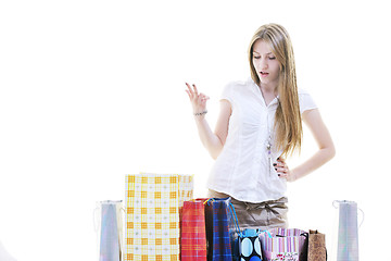 Image showing happy young adult women  shopping with colored bags