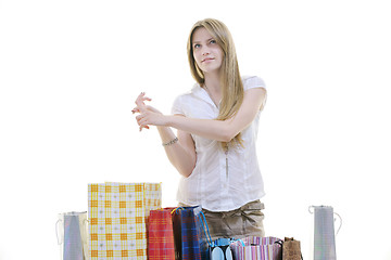 Image showing happy young adult women  shopping with colored bags