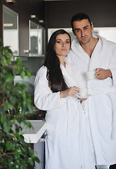 Image showing Young love couple taking fresh morning cup of coffee