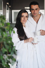 Image showing Young love couple taking fresh morning cup of coffee