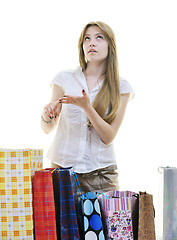 Image showing happy young adult women  shopping with colored bags