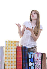 Image showing happy young adult women  shopping with colored bags