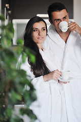 Image showing Young love couple taking fresh morning cup of coffee