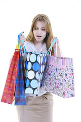 Image showing happy young adult women  shopping with colored bags