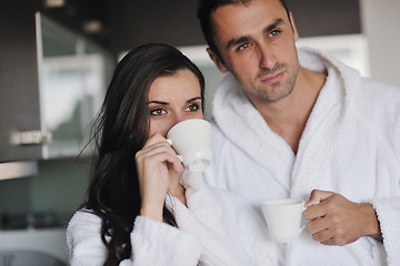 Image showing Young love couple taking fresh morning cup of coffee