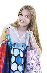 Image showing happy young adult women  shopping with colored bags