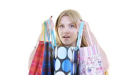 Image showing happy young adult women  shopping with colored bags