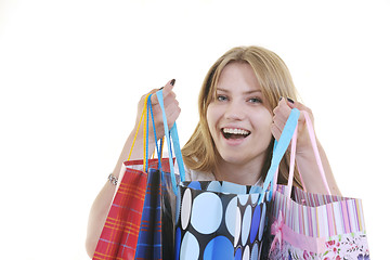 Image showing happy young adult women  shopping with colored bags