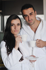 Image showing Young love couple taking fresh morning cup of coffee