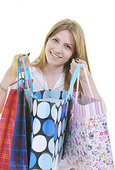 Image showing happy young adult women  shopping with colored bags