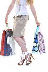 Image showing happy young adult women  shopping with colored bags