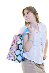 Image showing happy young adult women  shopping with colored bags