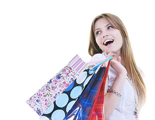 Image showing happy young adult women  shopping with colored bags