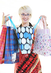 Image showing happy young adult women  shopping with colored bags