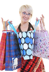 Image showing happy young adult women  shopping with colored bags