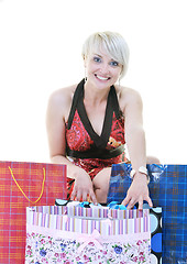 Image showing happy young adult women  shopping with colored bags