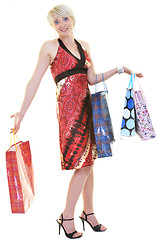 Image showing happy young adult women  shopping with colored bags