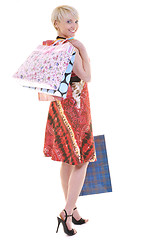 Image showing happy young adult women  shopping with colored bags