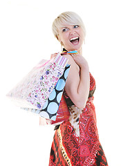 Image showing happy young adult women  shopping with colored bags