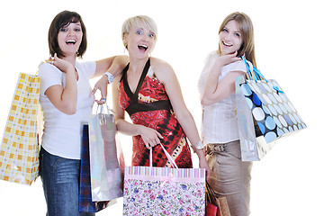 Image showing happy young adult women  shopping with colored bags