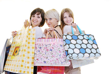 Image showing happy young adult women  shopping with colored bags