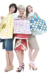 Image showing happy young adult women  shopping with colored bags