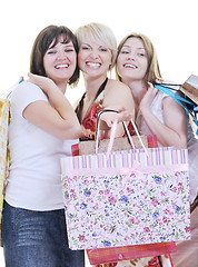 Image showing happy young adult women  shopping with colored bags