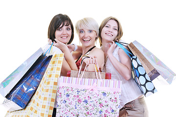 Image showing happy young adult women  shopping with colored bags