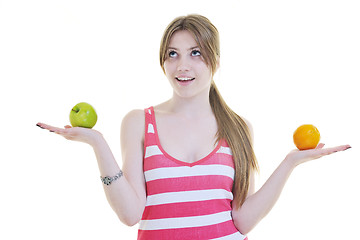 Image showing happy  young  woman eat apple isolated  on white