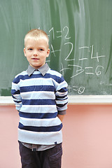 Image showing happy young boy at first grade math classes 