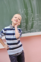 Image showing happy young boy at first grade math classes 