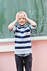 Image showing happy young boy at first grade math classes 